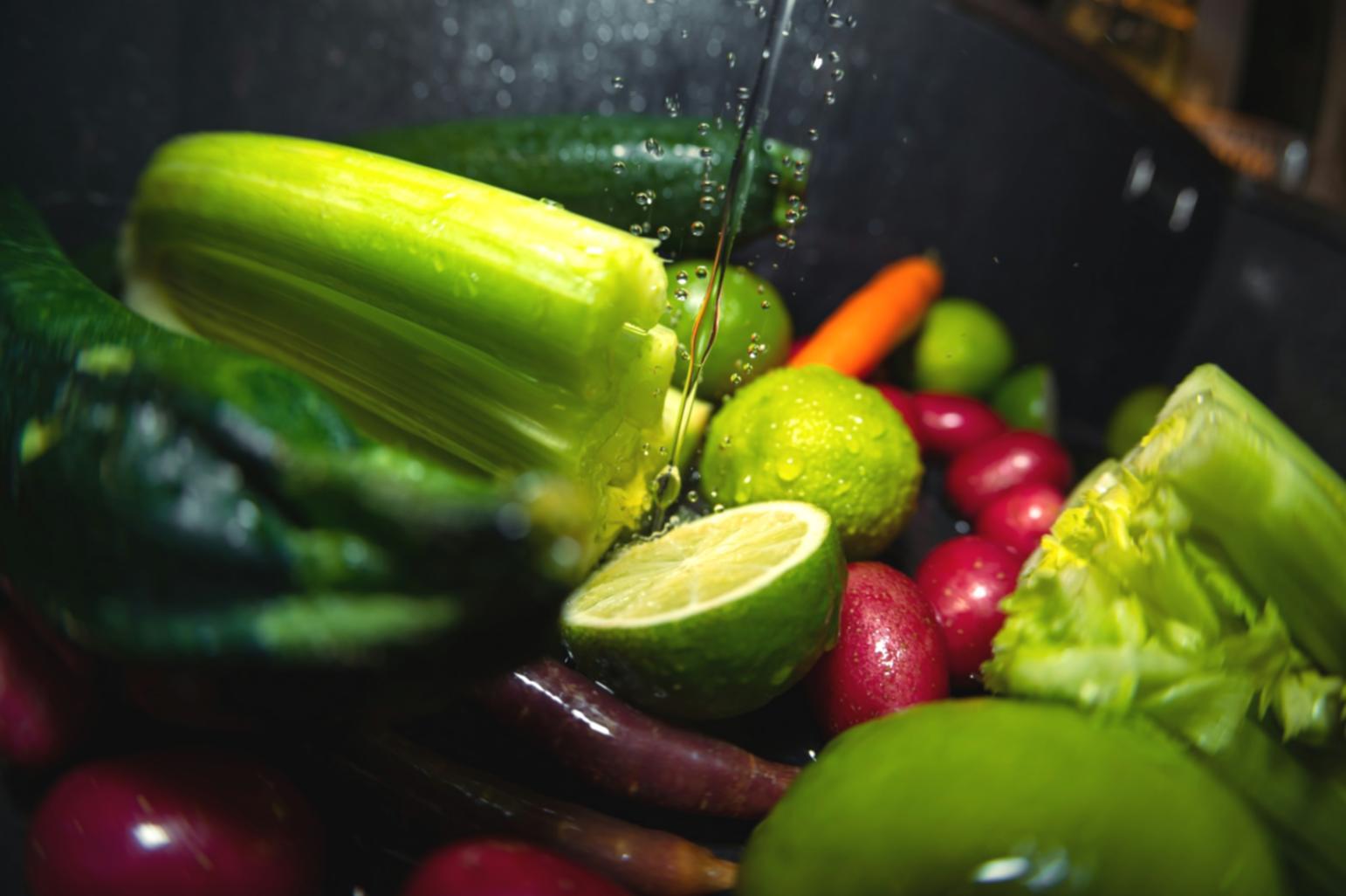 Professional kitchen workspace with culinary tools and ingredients arranged for menu development training